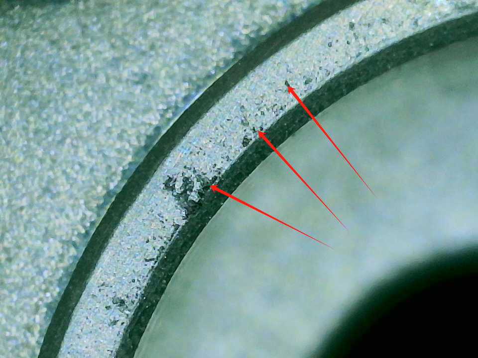 Softgel Die Roller Maintenance: How to Prevent Corrosion, Dents and Wear 7 Black corrosion spots scattered over the surface of a softgel die roller